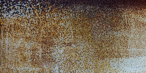 Abstract rusty metal background of painted metal texture with traces of corrosion.