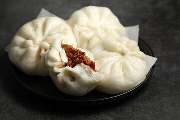 Steamed BBQ pork bun, also know as Baozo, is a type of filled bun or bread-like dumpling in various...