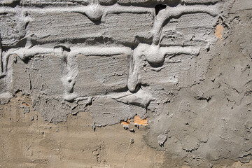 rough plastered brick wall. streaks of concrete. textured background