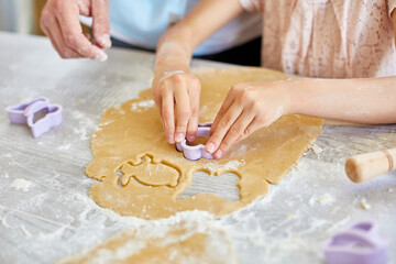 Father and daughter make cookies by mold, together in kitchen, Family cooking at home, happy family lifestyle.