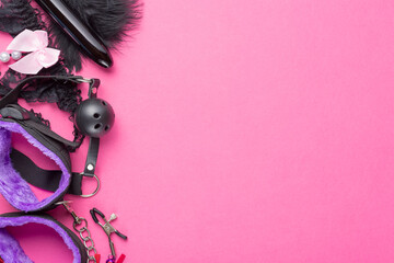 Intimate sex games. BDSM Tools dildo vibrator, female panties, gag, nipple clamps and handcuffs on...