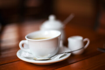 Cup of coffee. Morning atmospheric lighting, fashionable trendy spot soft focus. Preparation for design creative menu.