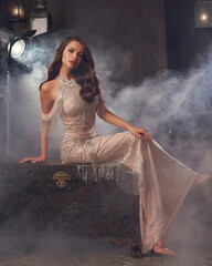 Full length gold hollywood stylish portrait. Elegant rich woman in expensive mermaid evening dress...