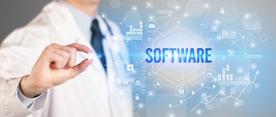Doctor giving a pill with SOFTWARE inscription, new technology solution concept