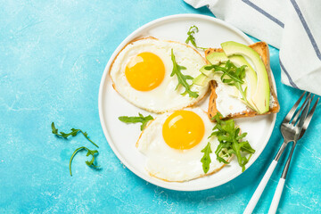 Healthy breakfast with egg, toast and salad.