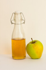 Apple juice with an Apple on a white background