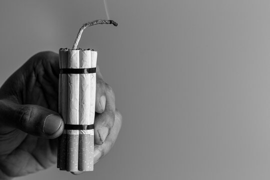 Man smoker.Cigarette like time bomb.Cigarettes is addictive to be cancer.smoking reduction campaign in World No Tobacco Day.