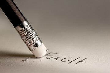 Closeup pencil eraser or delete on paper for removing a written mistake.Examination for fix and...