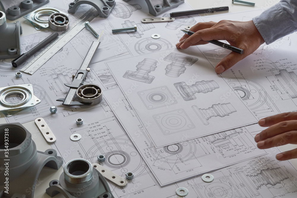 Aufkleber Engineer technician designing drawings mechanical parts engineering Engine.manufacturing factory Industry Industrial work project blueprints measuring bearings caliper tools