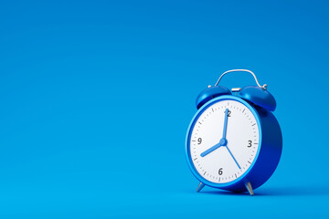 Blue alarm clock isolated on blue background with retro style. Classic analog clock and blank space. 3D rendering.
