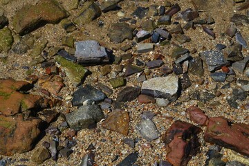 The beach has a natural crack rocks.