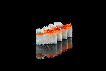 Close Up Of Sushi Roll On A Black Background . Japanese dish .