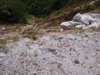 Naklejka na ściany i meble Wasted rocks filled to the slope