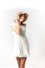 Beautiful Young Model posing in dress and hat on white background

