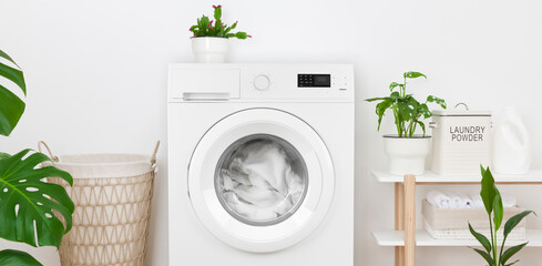 Close-up of rustic laundry room interior with washing machine - obrazy, fototapety, plakaty