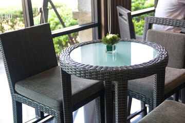 little plant on glass table in cafe dinner room