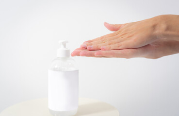 Hand of lady cleaning hands with alcohol gel or anti bacteria soap to stop germ, bacteria, virus. Covid19 coronavirus prevention