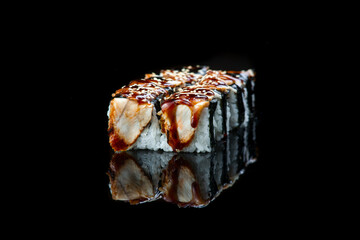 Sushi Roll On A Black Background reflection . Japanese food. Close Up.