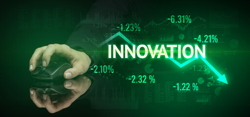 male hand holding wireless peripheral with INNOVATION inscription, modern business concept