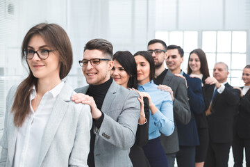 Fototapeta premium group of young business people standing behind each other