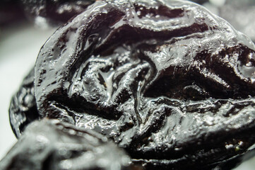 Black pieces of oil close up. Macro photography