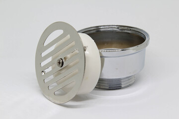 Sewer cover on white background.