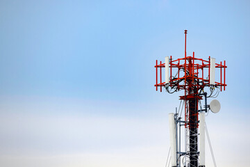 Telecommunication tower, broadcast pole, telephone transceiver or antenna with blue sky. Radio and...
