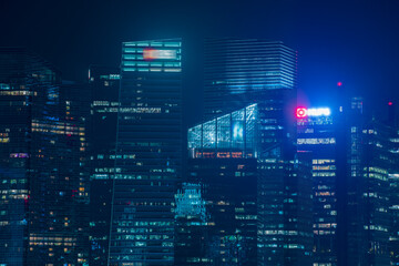 Office business building at night in blue tone.