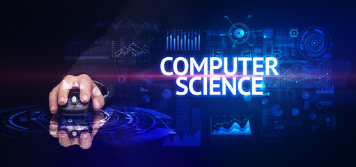 hand holding wireless peripheral with COMPUTER SCIENCE inscription, modern technology concept