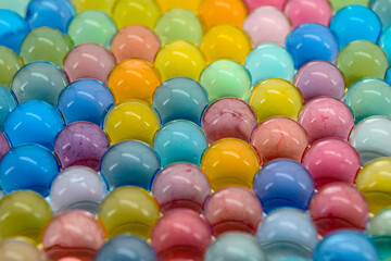 Small colourful hydrogel ball texture. Close up macro.