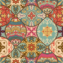 Seamless colorful patchwork tile with Islam, Arabic, Indian, ottoman motifs. Majolica pottery tile. Portuguese and Spain decor. Gaudi mosaic. Ceramic tile in talavera style. Vector illustration