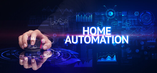 hand holding wireless peripheral with HOME AUTOMATION inscription, modern technology concept