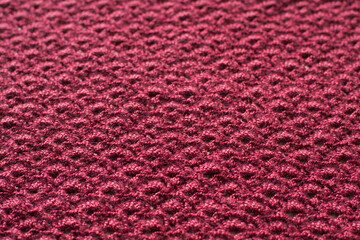 Beautiful knitted texture, dark red cloth, decorative wallpaper