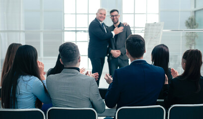 business partners standing together in a conference room