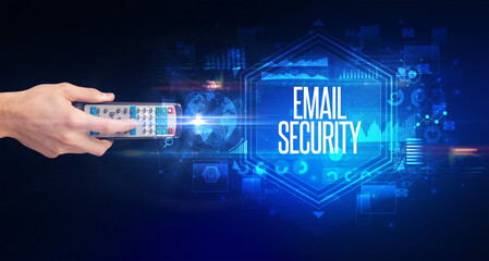 hand holding wireless peripheral with EMAIL SECURITY inscription, cyber security concept
