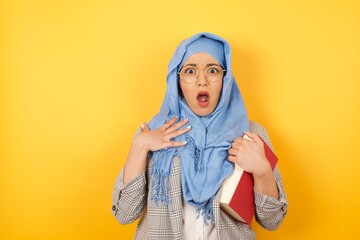 Closeup photo of attractive young muslim woman wearing hijab pointing direct finger own chest...