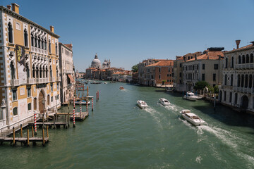 Fototapeta na wymiar Boats goes along the Grand Canal towards San Simeone Piccolo church in Venice, Italy.