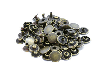 Close-up of button brass, Golden metallic, Accessory for leather work, Vintage style, Isolated on white background.