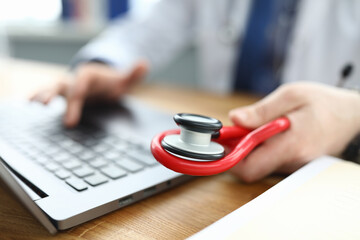 Therapist enters consultation data into laptop