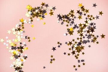 Gold and Silver Confetti in Shape of Stars on Pastel Background Sparkly Background Holiday Celebration Concept Festive Background