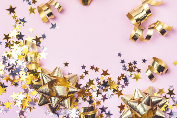 Gold and Silver Confetti in Shape of Stars on Pink Background Sparkly Background Holiday Celebration Concept Festive Background New Year