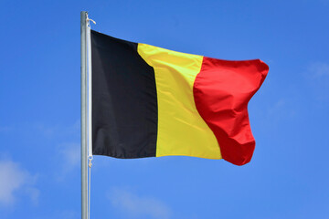 Belgium flag in the wind on the top of the mast