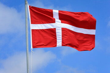 Denmark flag in the wind on the top of the mast