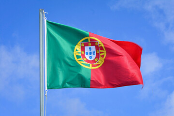 Portugal flag in the wind on the top of the mast