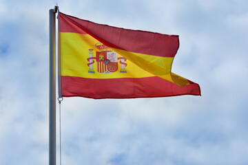 Flag of Spain waved high in the wind