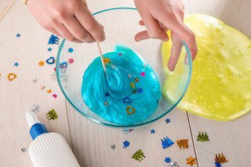 Girl making her own slime at home