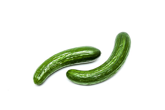 Fresh long cucumber over a white background