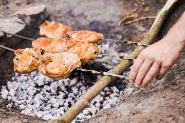 cooking juicy pork skewers in nature