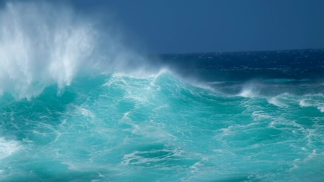 Powerful ocean wave break on shore in Hawaii