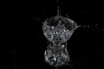 A splash with water and ice on a black background